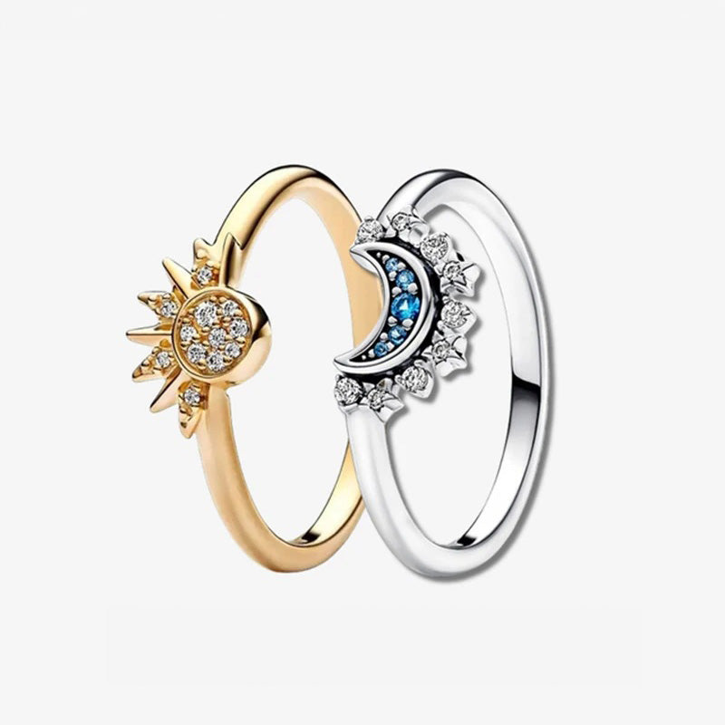 A stunning set of five Sun & Moon Harmony rings in 925 sterling silver, featuring celestial designs with sparkling zircon stones, displayed on a neutral background.