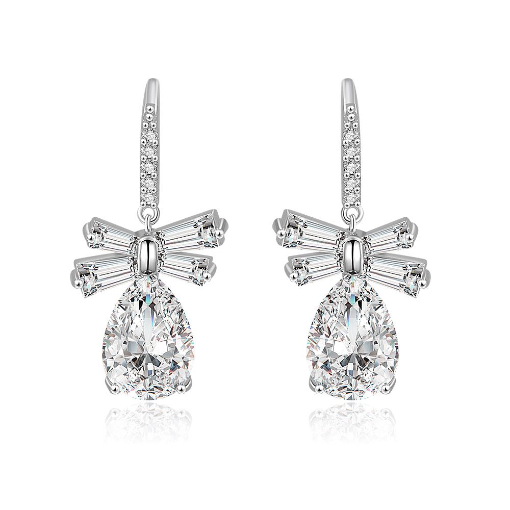 Front view of the White CZ Oval Drop Bow Earrings, featuring a large teardrop-shaped cubic zirconia stone set in rhodium-plated brass with a delicate bow detail.