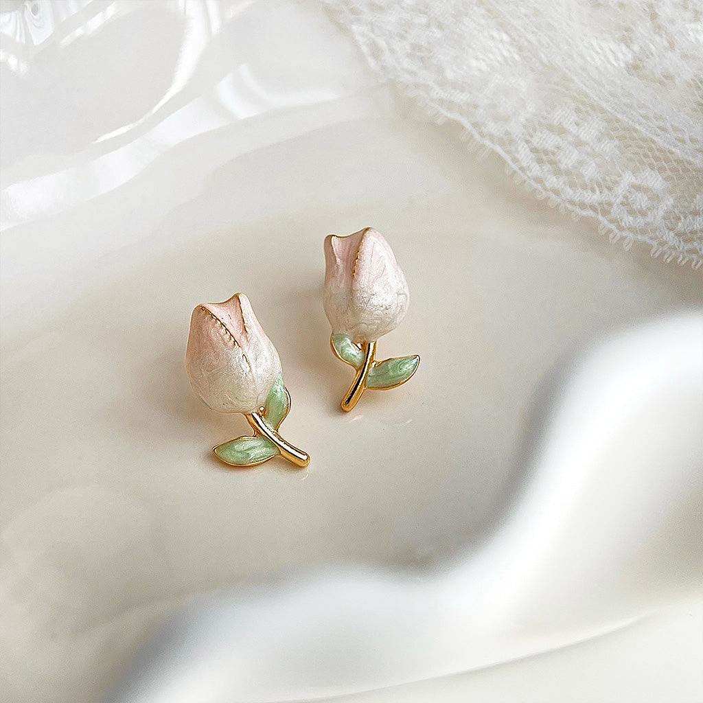 A pair of 14k gold-plated brass stud earrings shaped like tulips with a beautiful gradient enamel finish and gold stem details, on a clean white background.