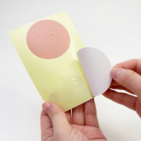 Embossed / Debossed Sticker - Embossed one-color printed sticker on uncoated paper