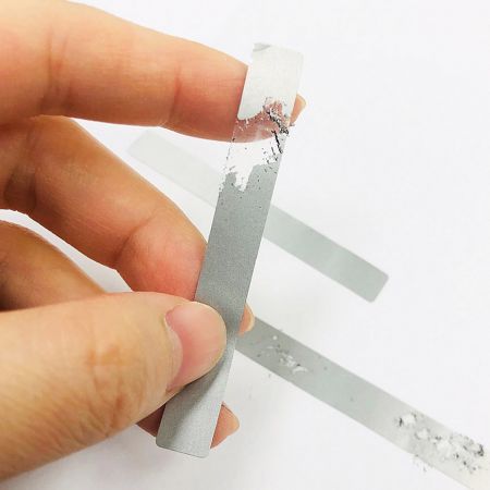 Scratch-Off Ink Sticker can be printed on transparent materials and applied to cover hidden content.