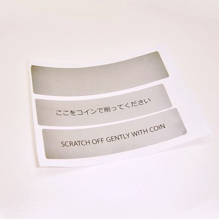 A single layer of black ink is printed over the Scratch-Off Ink Sticker.