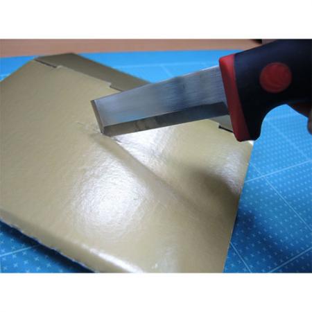 Chisel knife for cutting corrugated paper.