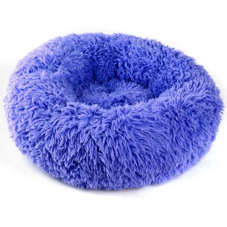 Lit douillet rond en peluche.