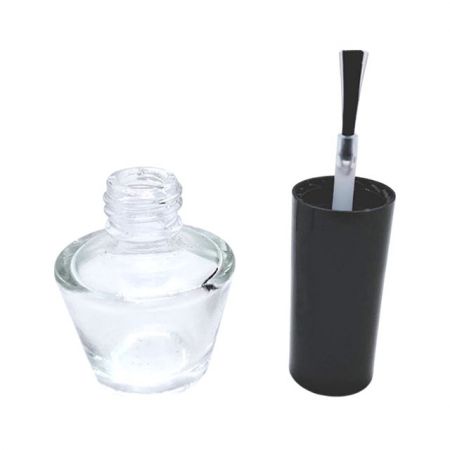 Empty nail polish bottle and plastic cap with brush