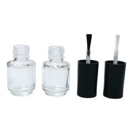 Botella redonda de esmalte de uñas y aplicador de pincel negro o blanco