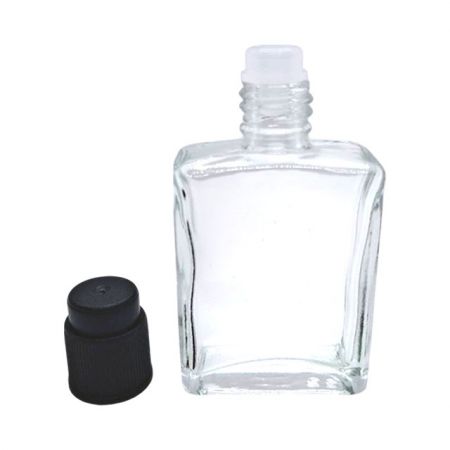 Tapa cilíndrica pequeña con tapón y botella de perfume