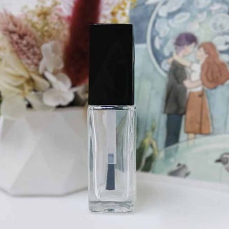 empty nail polish glass bottle with black cap