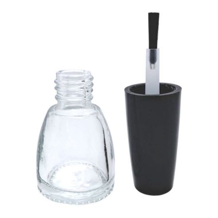 small glass bottle with cap and brush