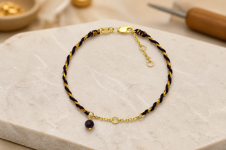 <strong>9BW0117 | Cord, Chain Components, and a Dangling Bead</strong>