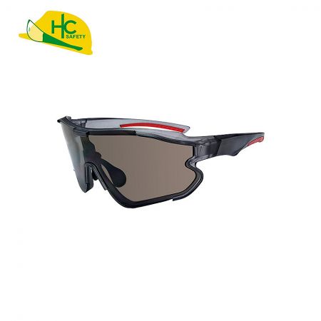 Lateral Protection & Impact Resistant Safety Glasses - This is a pair of sports safety glasses with a streamlined design and dark lenses, providing good protection and vision. Modern design, suitable for industrial or outdoor use.