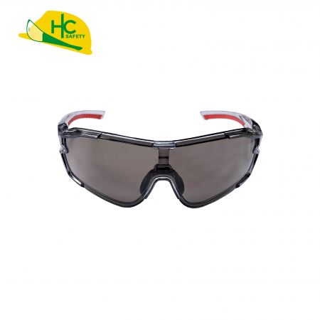 This is a pair of sports safety glasses with full coverage design and dark lenses to provide eye protection. There are red anti-slip pads on the frames of the glasses, which adds to the visual appeal.