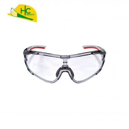 This is a pair of modern safety glasses with clear lenses and red temple anti-slip pads, providing comprehensive eye protection.