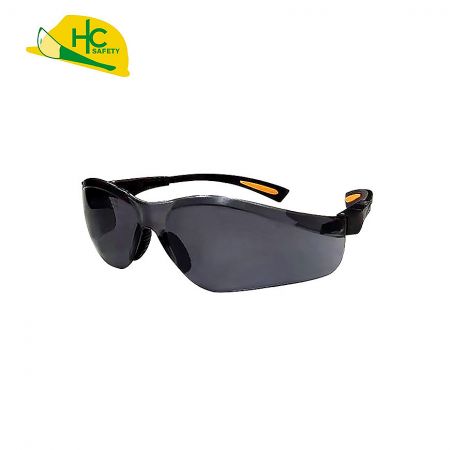 Smoke lenses with black temples embedded in orange anti-slip pads.