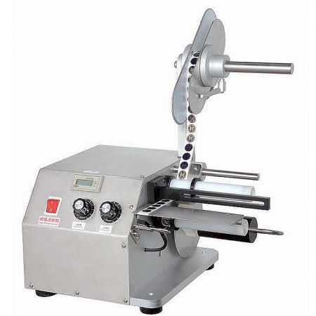 Label Peeling Machine - A CY-LS series label peeling machine automatically dispensing a label from a roll, ready for application.