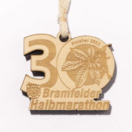 Wood medals are laser engraved without color. 20220922woodmedal-4.jpg