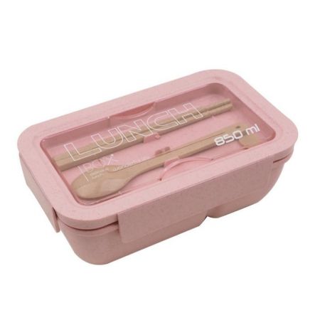 Bento-laatikko sisältää lusikan ja puikoilla.