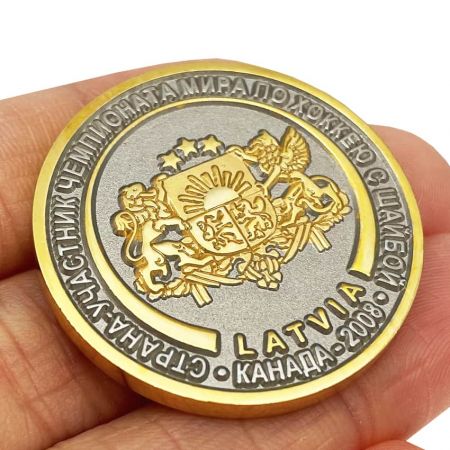 The coin design with two tones plating is made of brass, iron or zinc alloy.