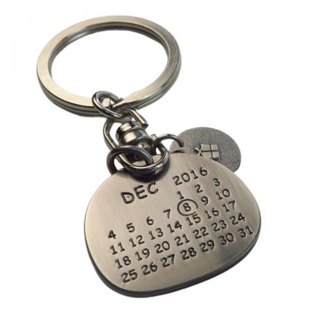 The metal keychain can be custom year, month and date.