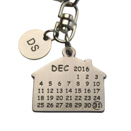 The calendar keychain can be engraved with your text.