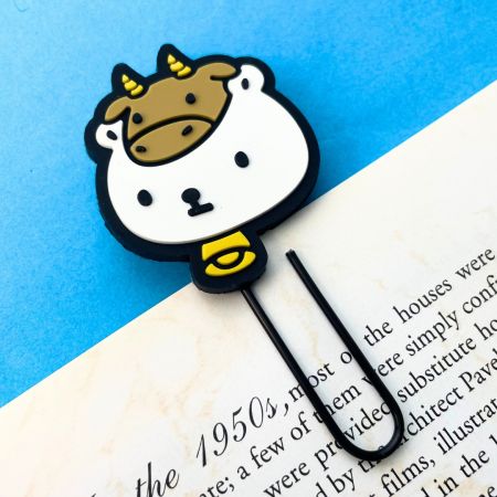 Keep your place in style with a PVC bookmark attached to a paper clip, offering both functionality and flair.