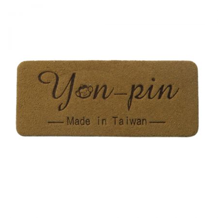 Perfect for high-end fashion, suede clothing labels are durable and can be customized with your brand logo or name.