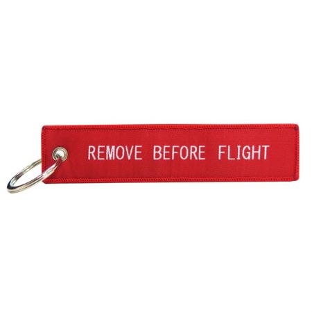 Der Entfernen Sie vor dem Flug Schlüsselanhänger kann auf beiden Seiten gleich oder unterschiedlich sein.