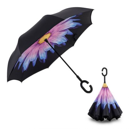 The inverted umbrella has a c-shaped handle that is easy to hold.