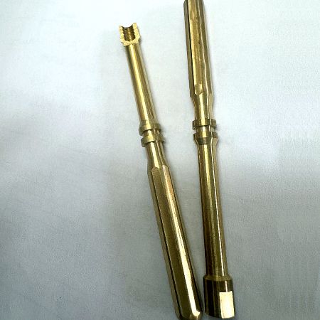 CNC Machined Octagonal Brass Shaft - Display of internal-threaded octagonal across-flat finished parts.