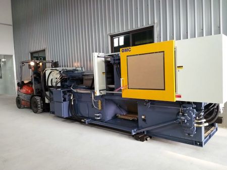 Hybrid injection molding machine applied to plastic screw caps production.