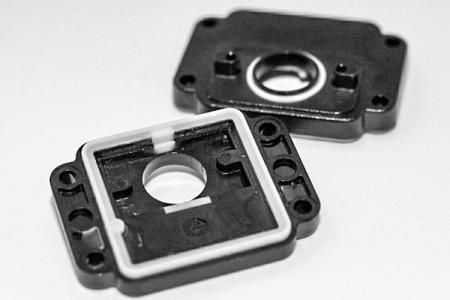 Silicone seal combined with plastics.