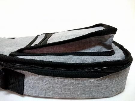 Collapsible front zipper pocket.