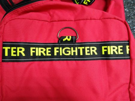 Jacquard webbing with "FIRE FIGHTER" printed on it.