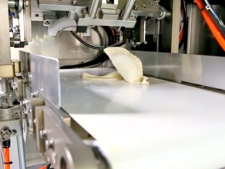 ANKO’s Ejection Mold Device can remove Empanadas from the forming mold to be placed on the conveyor