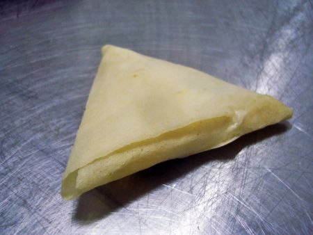 ANKO's SRP is used to produce samosa wraps, and the samosas are then folded by hand