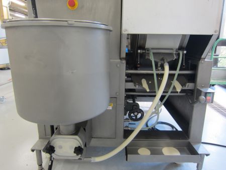 Batter is applied to the baking wheel to make Spring Roll wrappers