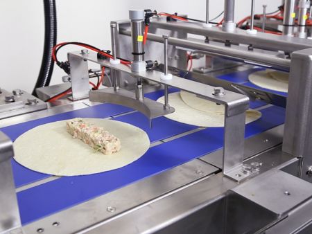 Cooked vegetable fillings can also be extruded precisely onto the tortillas
