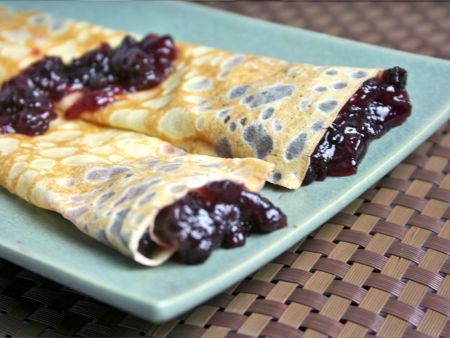 Crepes can be filled with blueberry jam to make Palacsinta
