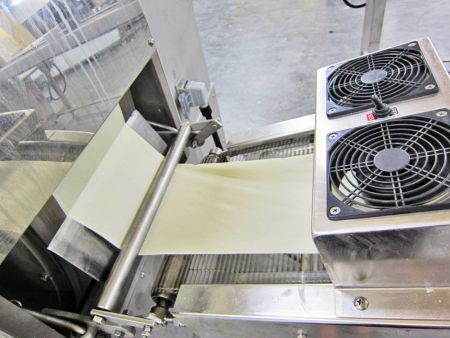 Dough sheets are cooled by fans