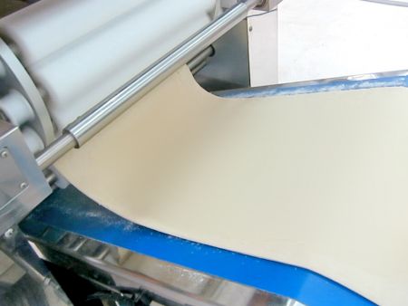 Pressing out a thin dough sheet