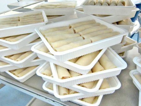 Spring Rolls placed in containers for packaging