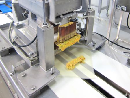 The filling is divided and placed on top of a Spring Roll wrapper