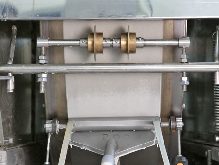 The roller cutters divide the wrapper into three pieces, making it easy to produce Samosas and other products