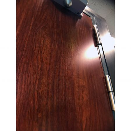 Side view of a morden fireproof door panel decorated with Redwood wood grain PVC Film Laminated Metal