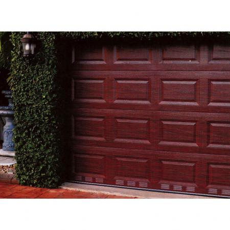 Garage door with redcherry wood grain laminated metal surface