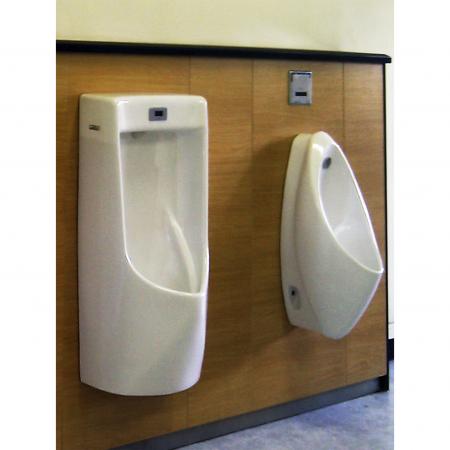 Long distance, side view of toilet wall panels decorated with beechwood grain laminated metal