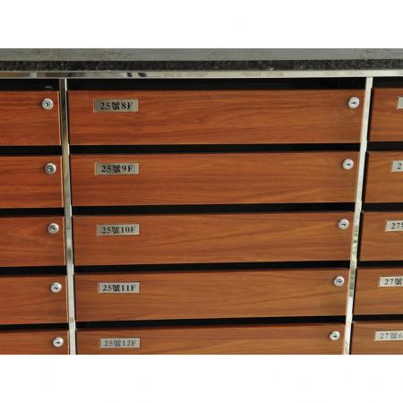 Close-up front view of a high-end  indoor mailbox decorated with Walnut grain PVC laminated metal plate