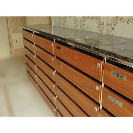 Close-up side view of a high-end  indoor mailbox decorated with Walnut grain PVC laminated metal plate