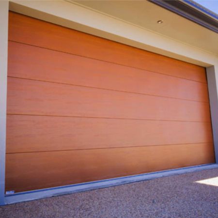 使用花梨木纹PVC覆膜金属钢板装饰表面的车库卷门侧面照