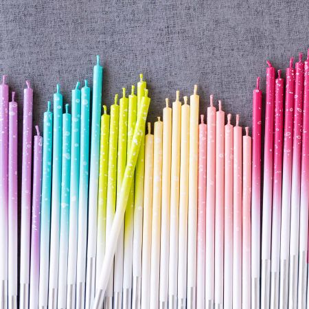 Gradient Birthday Candle - The gradient long candle features a print design resembling white snowflakes on its surface, with soothing color palettes including peach, cream puff, lemongrass, pink, mint, and blueberry, available in six single-color combinations. Additionally, there are colorful combinations to choose from.